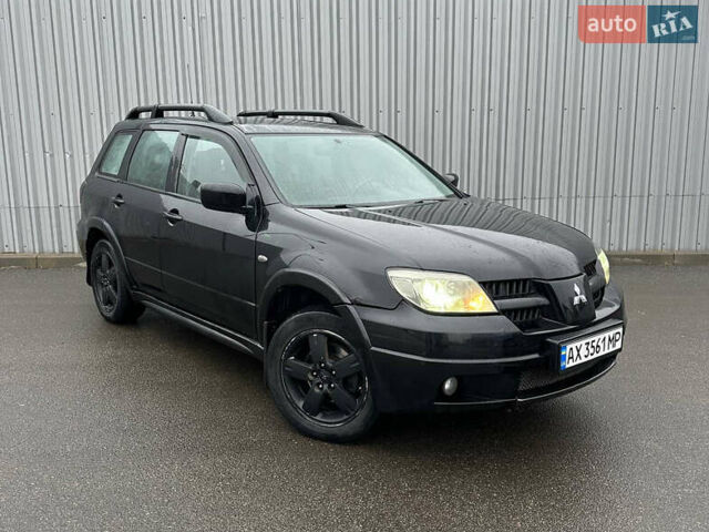 Чорний Міцубісі Аутлендер, об'ємом двигуна 2.38 л та пробігом 175 тис. км за 6000 $, фото 1 на Automoto.ua
