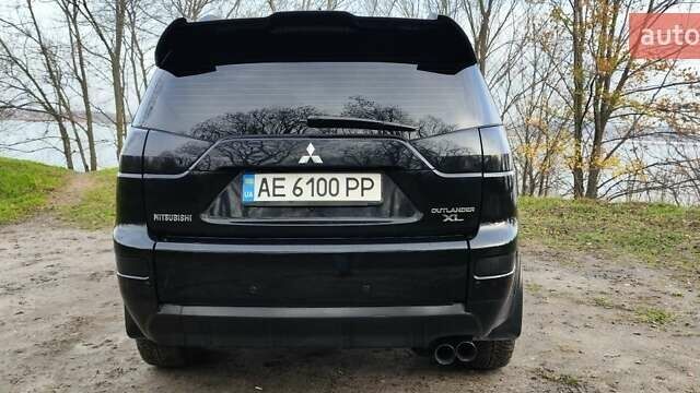 Черный Мицубиси Аутлендер, объемом двигателя 3 л и пробегом 190 тыс. км за 10000 $, фото 1 на Automoto.ua