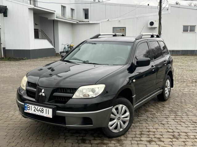 Чорний Міцубісі Аутлендер, об'ємом двигуна 2 л та пробігом 220 тис. км за 6299 $, фото 1 на Automoto.ua