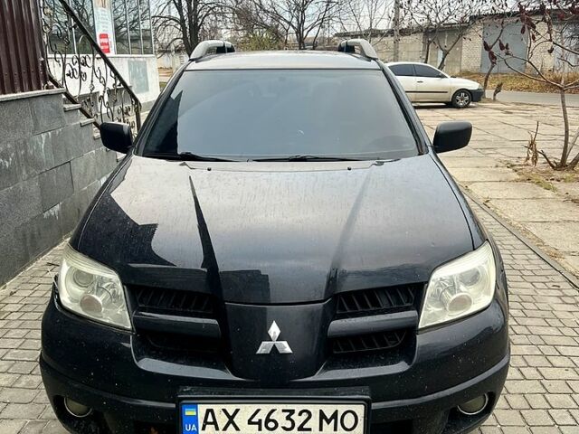 Чорний Міцубісі Аутлендер, об'ємом двигуна 2.4 л та пробігом 267 тис. км за 6000 $, фото 1 на Automoto.ua