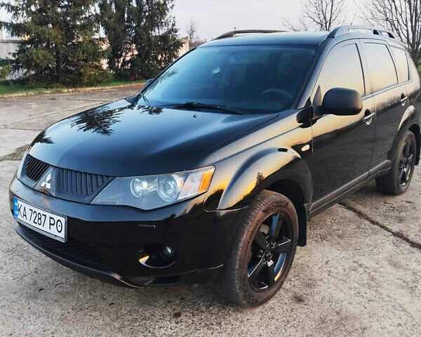 Черный Мицубиси Аутлендер, объемом двигателя 3 л и пробегом 225 тыс. км за 9200 $, фото 1 на Automoto.ua