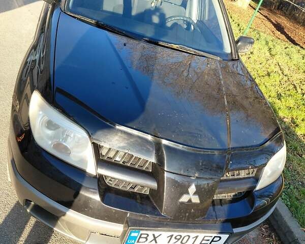 Чорний Міцубісі Аутлендер, об'ємом двигуна 2 л та пробігом 260 тис. км за 5500 $, фото 1 на Automoto.ua