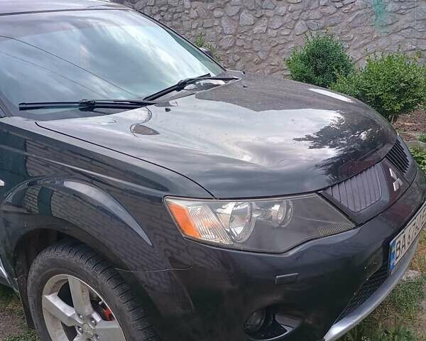 Черный Мицубиси Аутлендер, объемом двигателя 1.97 л и пробегом 218 тыс. км за 10500 $, фото 1 на Automoto.ua