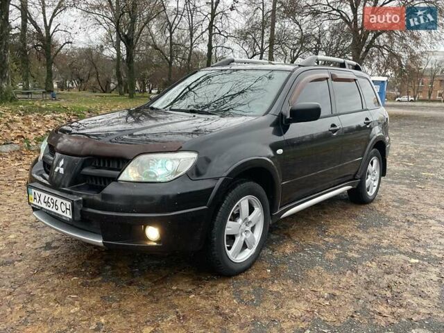 Чорний Міцубісі Аутлендер, об'ємом двигуна 2.4 л та пробігом 213 тис. км за 6850 $, фото 1 на Automoto.ua