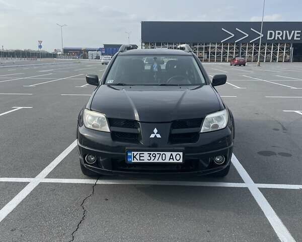 Черный Мицубиси Аутлендер, объемом двигателя 2.38 л и пробегом 180 тыс. км за 6900 $, фото 1 на Automoto.ua