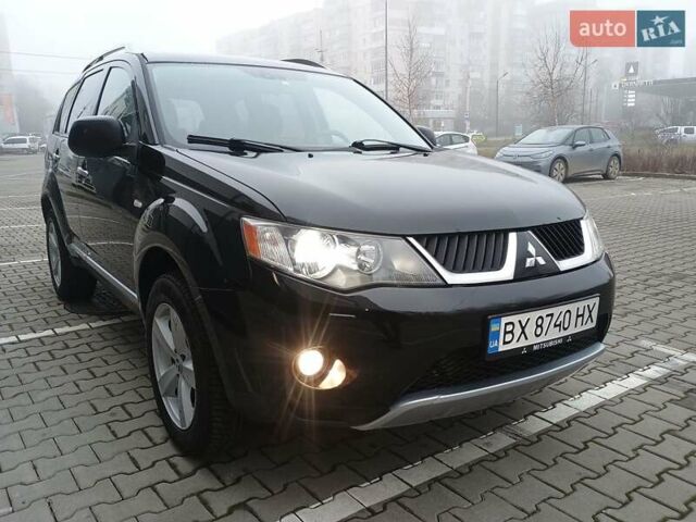 Чорний Міцубісі Аутлендер, об'ємом двигуна 2 л та пробігом 250 тис. км за 9350 $, фото 1 на Automoto.ua