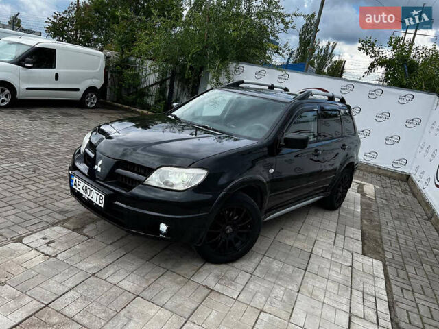 Чорний Міцубісі Аутлендер, об'ємом двигуна 2.4 л та пробігом 231 тис. км за 6200 $, фото 1 на Automoto.ua