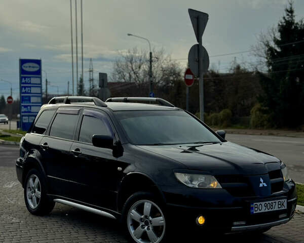 Чорний Міцубісі Аутлендер, об'ємом двигуна 2 л та пробігом 280 тис. км за 7500 $, фото 1 на Automoto.ua