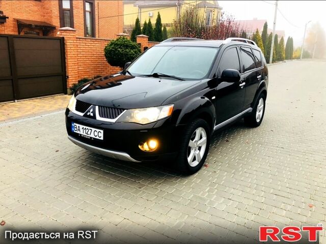 Черный Мицубиси Аутлендер, объемом двигателя 3 л и пробегом 230 тыс. км за 8999 $, фото 1 на Automoto.ua