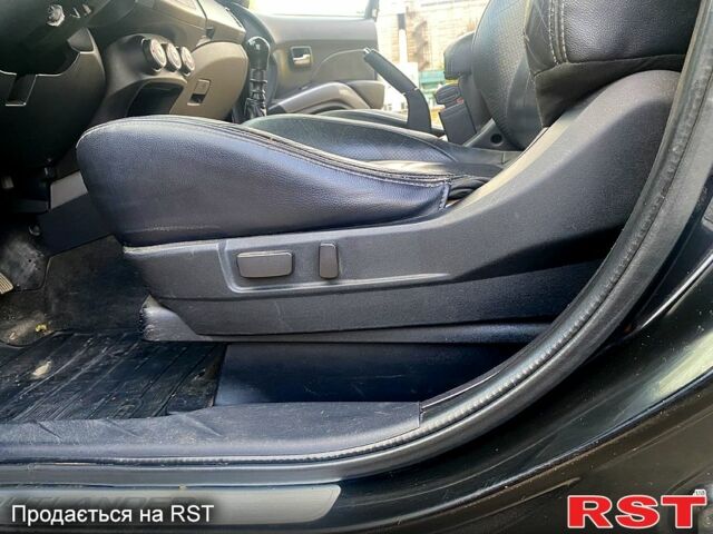 Черный Мицубиси Аутлендер, объемом двигателя 2 л и пробегом 207 тыс. км за 8100 $, фото 1 на Automoto.ua