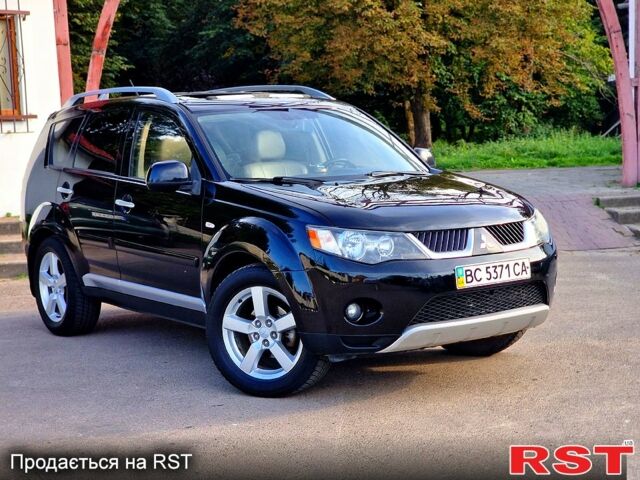 Черный Мицубиси Аутлендер, объемом двигателя 2.4 л и пробегом 189 тыс. км за 7000 $, фото 1 на Automoto.ua