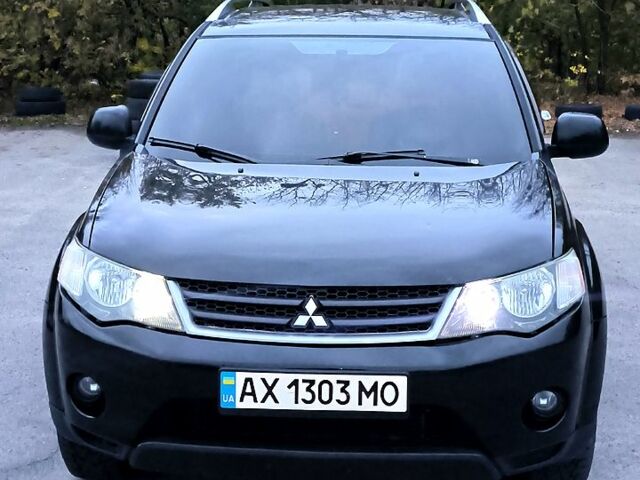 Черный Мицубиси Аутлендер, объемом двигателя 2.4 л и пробегом 210 тыс. км за 7800 $, фото 1 на Automoto.ua