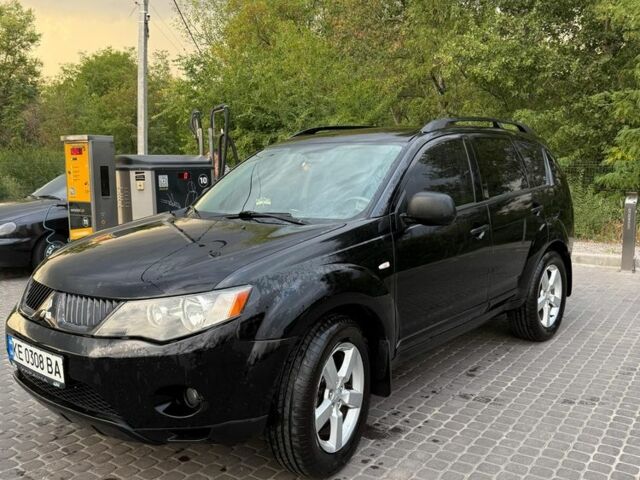 Черный Мицубиси Аутлендер, объемом двигателя 2.4 л и пробегом 369 тыс. км за 8500 $, фото 1 на Automoto.ua