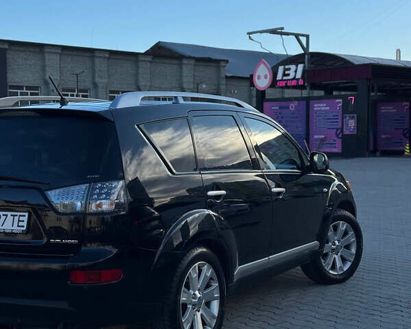 Черный Мицубиси Аутлендер, объемом двигателя 1.97 л и пробегом 202 тыс. км за 9700 $, фото 1 на Automoto.ua