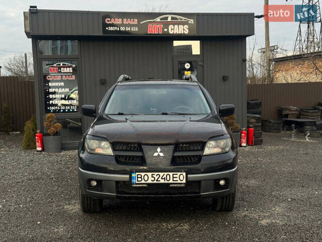 Черный Мицубиси Аутлендер, объемом двигателя 2 л и пробегом 240 тыс. км за 5500 $, фото 1 на Automoto.ua