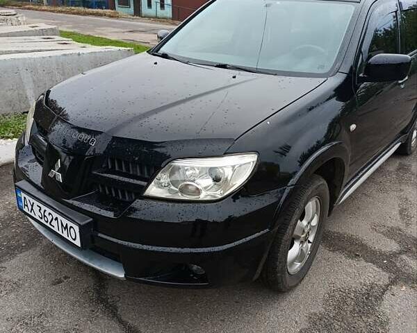 Мицубиси Аутлендер 2008 в Изюме на Automoto.ua Черный Мицубиси Аутлендер, объемом двигателя 2 л и пробегом 270 тыс. км за 7200 $, фото 1 на Automoto.ua
