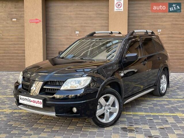 Черный Мицубиси Аутлендер, объемом двигателя 2 л и пробегом 270 тыс. км за 7199 $, фото 1 на Automoto.ua