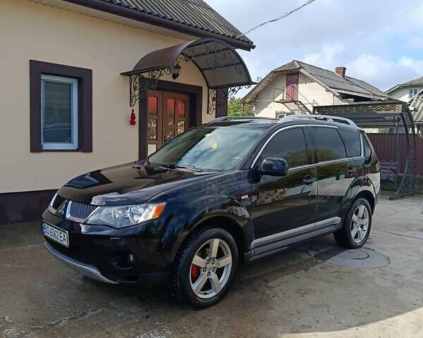 Черный Мицубиси Аутлендер, объемом двигателя 2.36 л и пробегом 203 тыс. км за 9200 $, фото 1 на Automoto.ua