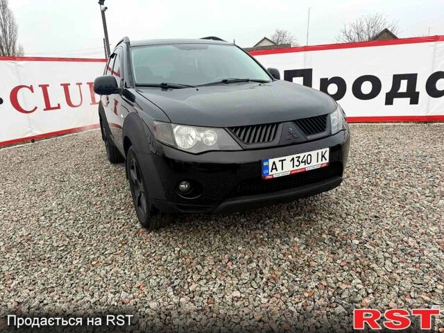 Чорний Міцубісі Аутлендер, об'ємом двигуна 2.4 л та пробігом 200 тис. км за 9999 $, фото 1 на Automoto.ua