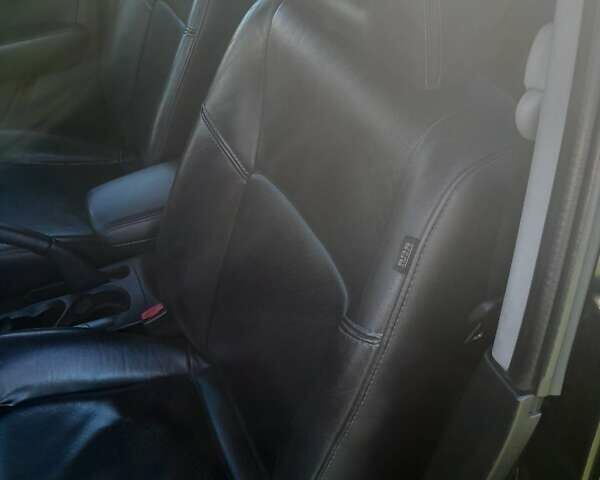 Чорний Міцубісі Аутлендер, об'ємом двигуна 2.38 л та пробігом 161 тис. км за 7500 $, фото 1 на Automoto.ua