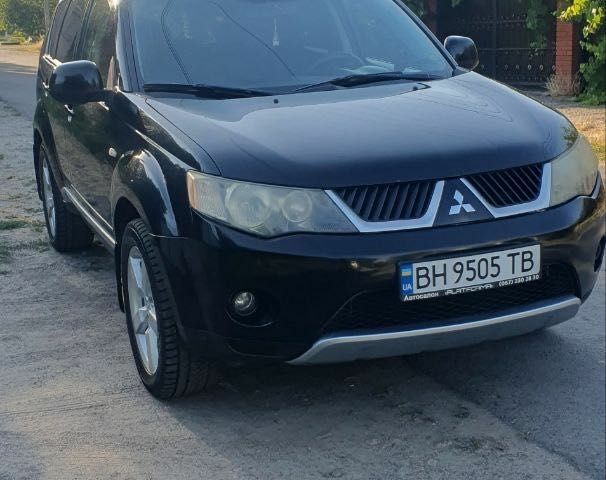 Чорний Міцубісі Аутлендер, об'ємом двигуна 2.4 л та пробігом 325 тис. км за 7500 $, фото 1 на Automoto.ua