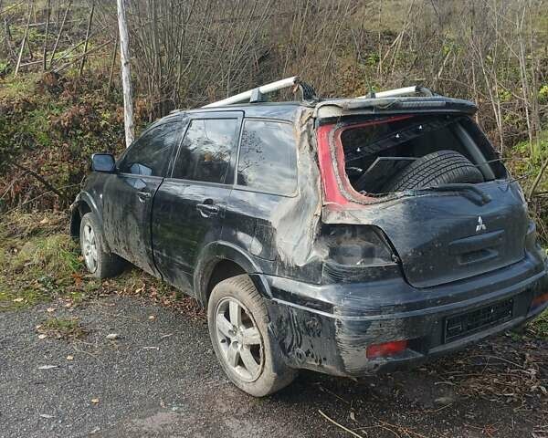 Черный Мицубиси Аутлендер, объемом двигателя 2.38 л и пробегом 270 тыс. км за 1700 $, фото 1 на Automoto.ua