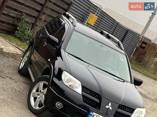 Черный Мицубиси Аутлендер, объемом двигателя 2.4 л и пробегом 178 тыс. км за 6900 $, фото 1 на Automoto.ua