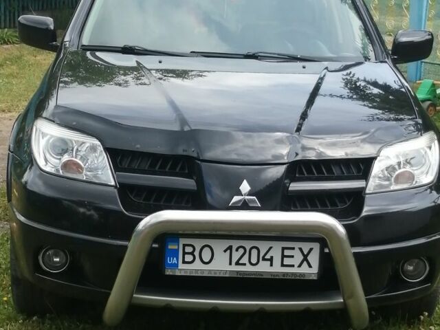 Чорний Міцубісі Аутлендер, об'ємом двигуна 2 л та пробігом 208 тис. км за 6700 $, фото 1 на Automoto.ua