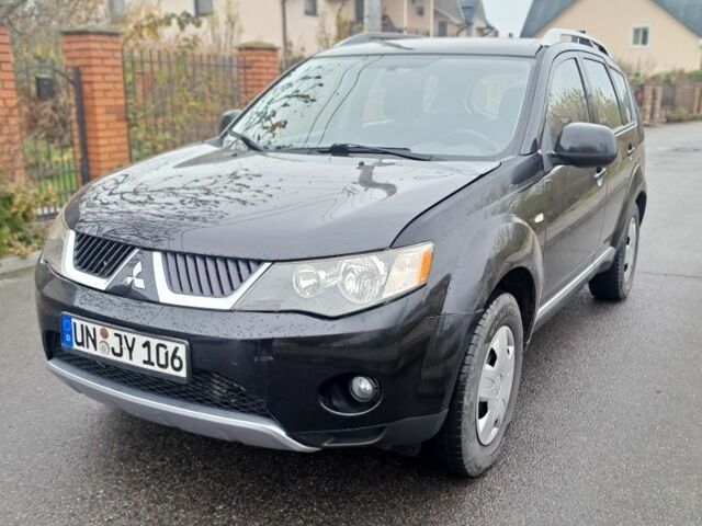 Черный Мицубиси Аутлендер, объемом двигателя 2 л и пробегом 226 тыс. км за 4700 $, фото 1 на Automoto.ua