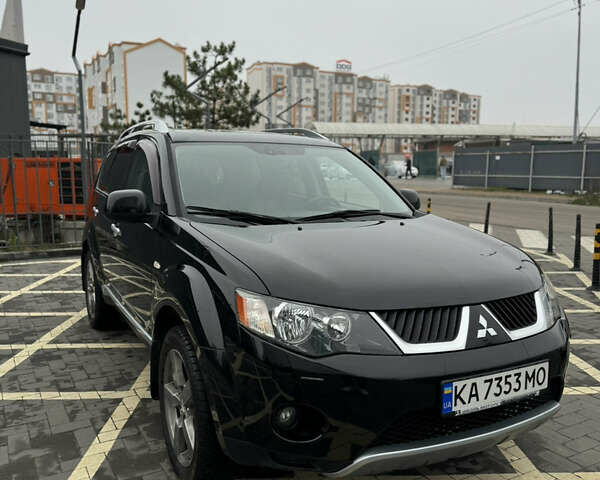 Черный Мицубиси Аутлендер, объемом двигателя 2.36 л и пробегом 120 тыс. км за 10100 $, фото 1 на Automoto.ua