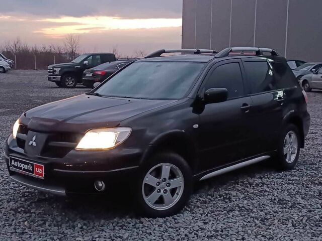 Черный Мицубиси Аутлендер, объемом двигателя 2 л и пробегом 271 тыс. км за 6940 $, фото 1 на Automoto.ua