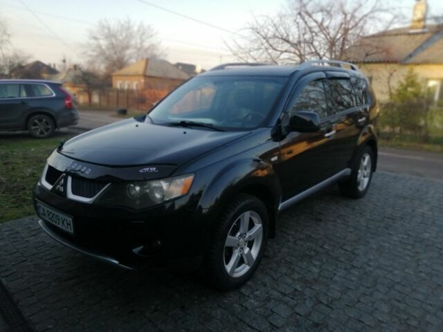 Черный Мицубиси Аутлендер, объемом двигателя 2.4 л и пробегом 228 тыс. км за 7850 $, фото 1 на Automoto.ua