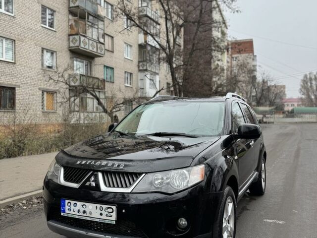 Черный Мицубиси Аутлендер, объемом двигателя 2 л и пробегом 377 тыс. км за 5200 $, фото 1 на Automoto.ua