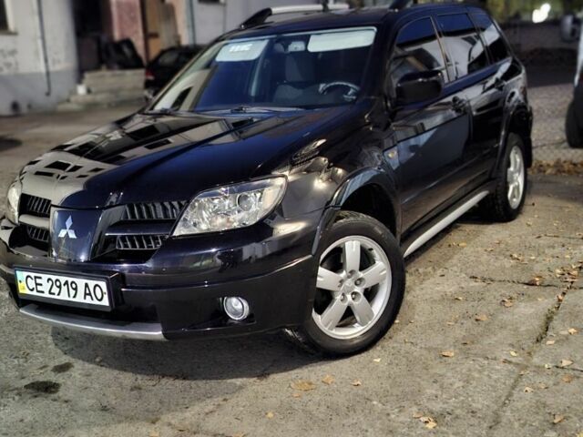 Чорний Міцубісі Аутлендер, об'ємом двигуна 2 л та пробігом 117 тис. км за 7900 $, фото 1 на Automoto.ua