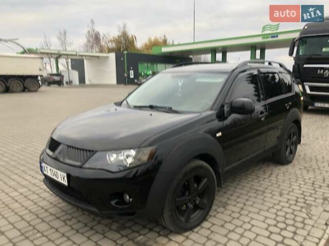 Чорний Міцубісі Аутлендер, об'ємом двигуна 2.4 л та пробігом 199 тис. км за 8999 $, фото 1 на Automoto.ua