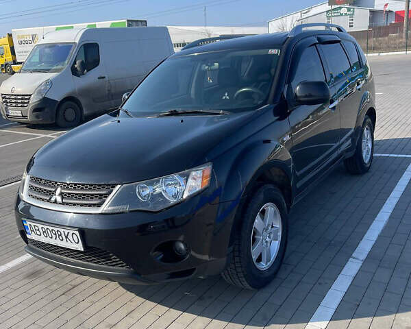 Чорний Міцубісі Аутлендер, об'ємом двигуна 2.4 л та пробігом 195 тис. км за 8600 $, фото 1 на Automoto.ua