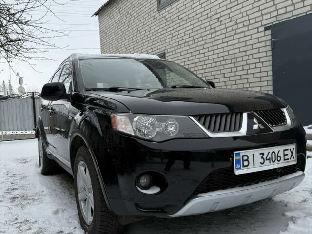 Черный Мицубиси Аутлендер, объемом двигателя 2 л и пробегом 320 тыс. км за 9000 $, фото 1 на Automoto.ua