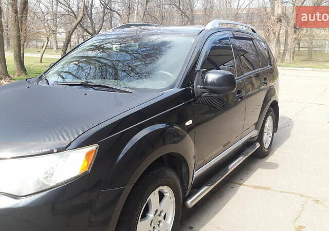 Чорний Міцубісі Аутлендер, об'ємом двигуна 2.36 л та пробігом 277 тис. км за 8500 $, фото 1 на Automoto.ua