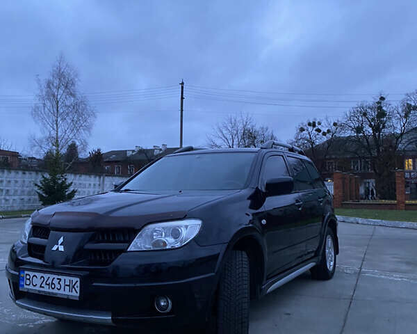 Чорний Міцубісі Аутлендер, об'ємом двигуна 2 л та пробігом 271 тис. км за 6799 $, фото 1 на Automoto.ua