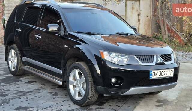 Чорний Міцубісі Аутлендер, об'ємом двигуна 2.4 л та пробігом 230 тис. км за 9700 $, фото 1 на Automoto.ua
