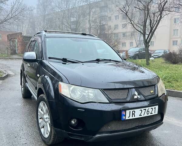 Чорний Міцубісі Аутлендер, об'ємом двигуна 2 л та пробігом 330 тис. км за 4900 $, фото 1 на Automoto.ua