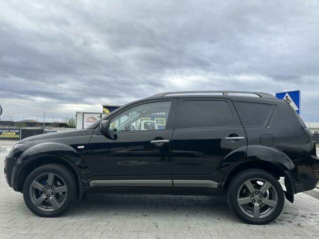Чорний Міцубісі Аутлендер, об'ємом двигуна 2.4 л та пробігом 218 тис. км за 10000 $, фото 1 на Automoto.ua