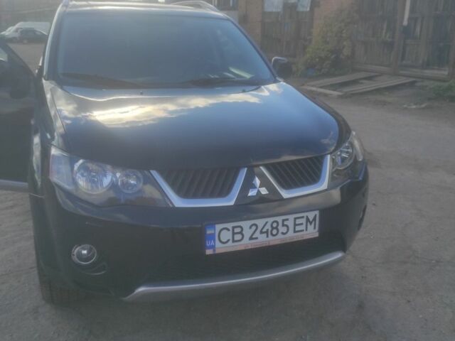 Черный Мицубиси Аутлендер, объемом двигателя 3 л и пробегом 300 тыс. км за 9000 $, фото 1 на Automoto.ua