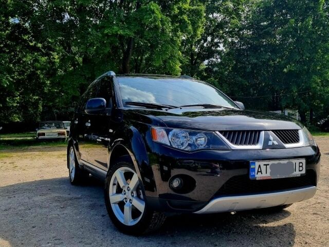 Черный Мицубиси Аутлендер, объемом двигателя 2.4 л и пробегом 234 тыс. км за 9800 $, фото 1 на Automoto.ua