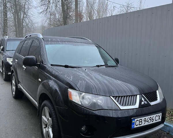 Черный Мицубиси Аутлендер, объемом двигателя 2.4 л и пробегом 237 тыс. км за 5000 $, фото 1 на Automoto.ua