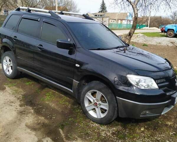 Черный Мицубиси Аутлендер, объемом двигателя 2 л и пробегом 263 тыс. км за 6900 $, фото 1 на Automoto.ua