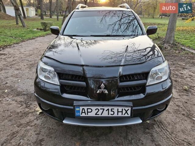 Чорний Міцубісі Аутлендер, об'ємом двигуна 2.38 л та пробігом 245 тис. км за 6800 $, фото 1 на Automoto.ua