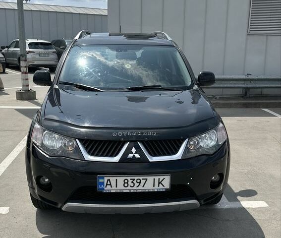 Чорний Міцубісі Аутлендер, об'ємом двигуна 2.4 л та пробігом 137 тис. км за 8700 $, фото 1 на Automoto.ua