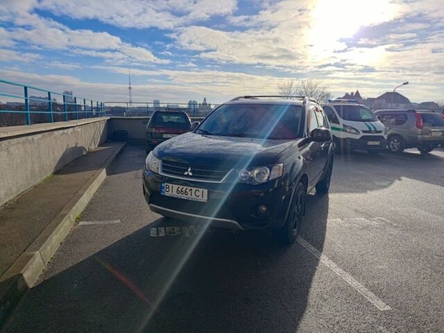 Черный Мицубиси Аутлендер, объемом двигателя 2.4 л и пробегом 250 тыс. км за 8500 $, фото 1 на Automoto.ua