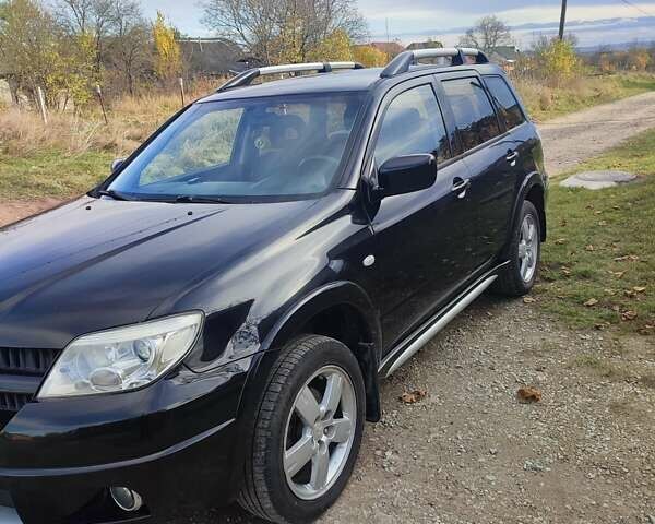 Міцубісі Аутлендер 2008 у Івано-Франківську на Automoto.ua Чорний Міцубісі Аутлендер, об'ємом двигуна 2 л та пробігом 128 тис. км за 7000 $, фото 1 на Automoto.ua